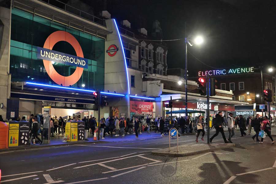 Exterior of Brixton underground station at night Brixton London