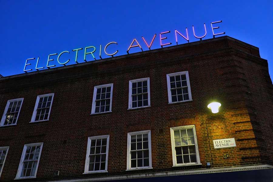 Multi coloured neon Electric Avenue sign Brixton London