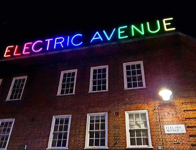 Multi coloured neon Electric Avenue sign Brixton London