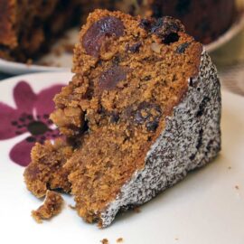 One slice of vegan cherry and walnut mincemeat fruitcake