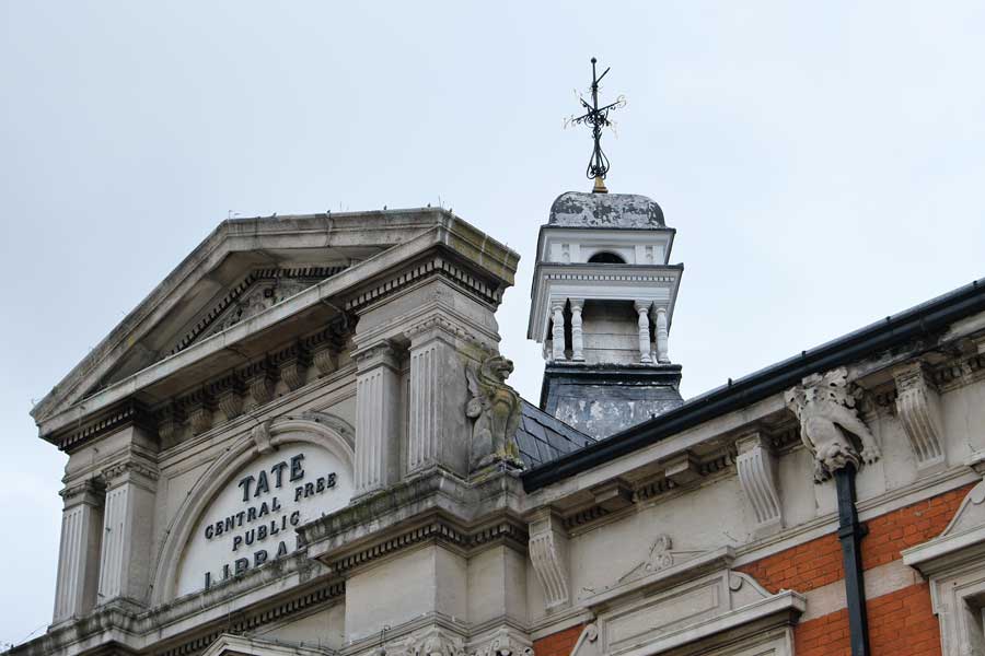 Detail of the roof entrance sign of Tate library Brixton London