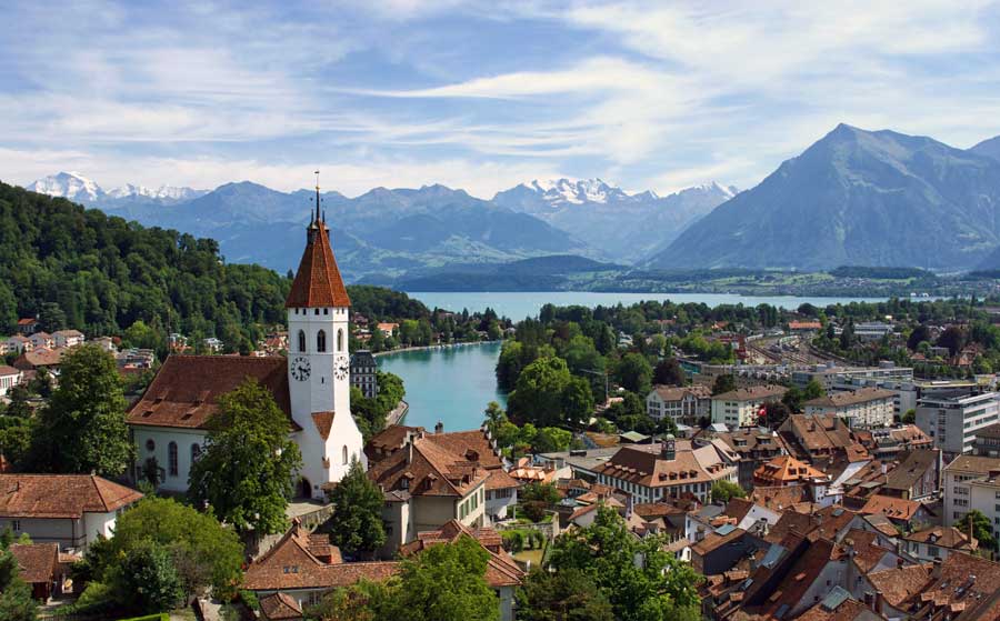 The town of Thun in Switzerland with lake and mountains in background