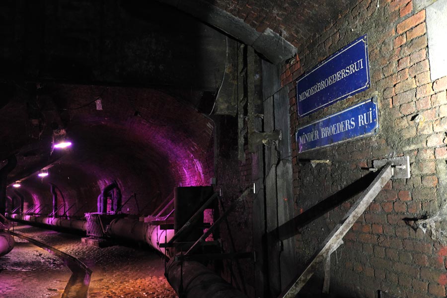 Street signs showing the streets above in historic hidden canals and sewers under Antwerp