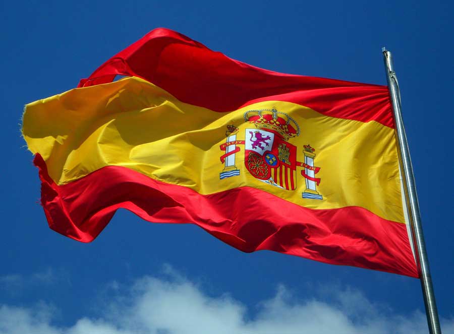 Flag of Spain against blue sky
Image by M W from Pixabay