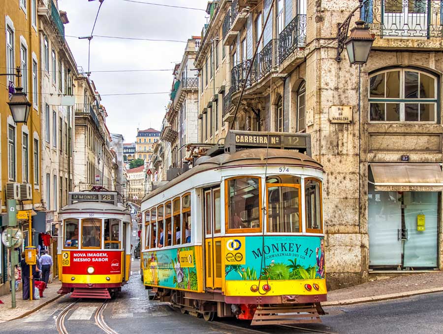 Two colourful trams in Rua da Madalena Lisbon Portugal
Image by Andrzej from Pixabay