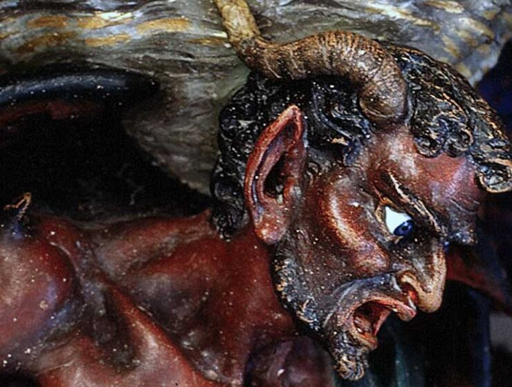 The figure of the Devil Asmodeus supporting the Holy Water Stoup at Rennes le Château in the Languedoc France