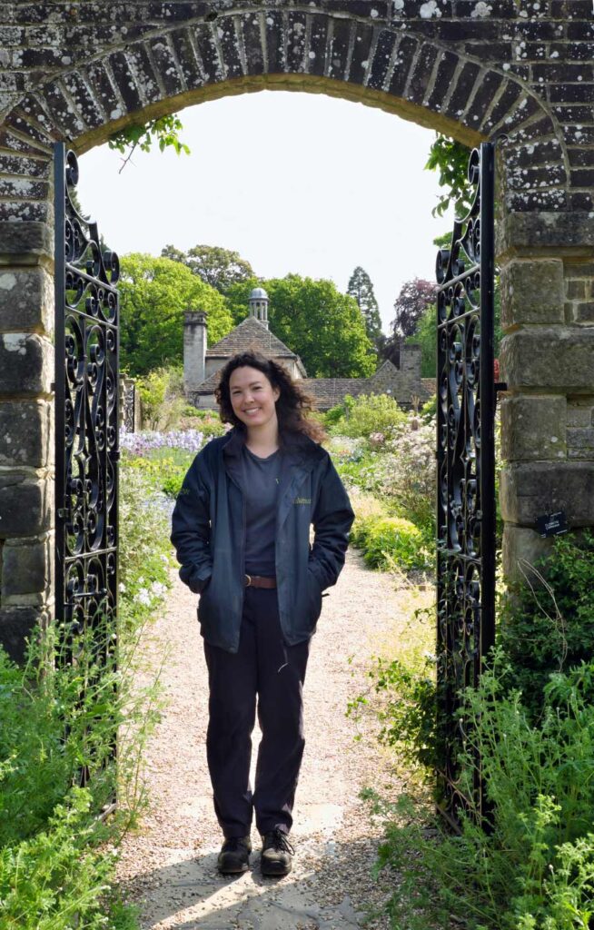 Maud Verstappen Volunteer Lead at the entrance to the walled garden at Wakehurst West Sussex