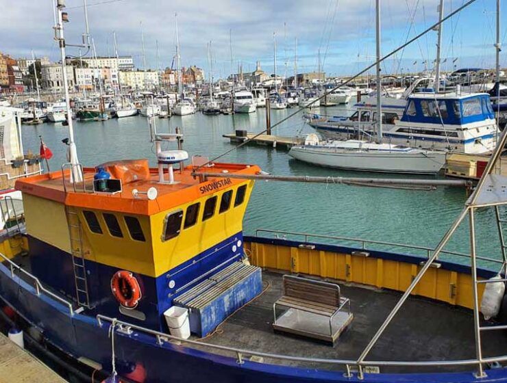 Looking across the moored boats in Ramsgate Royal Harbour in Kent UK
