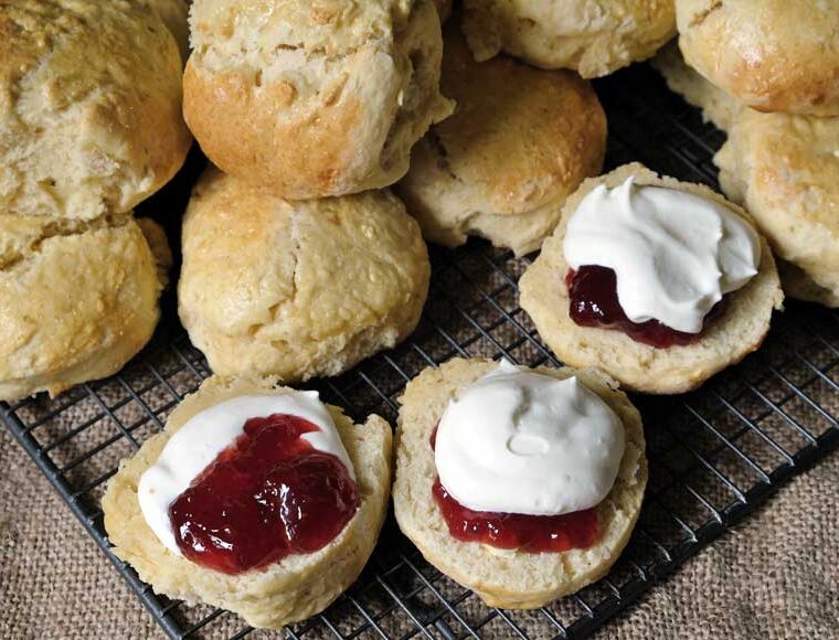 Scones made with sparkling wine and served with strawberry jam and plant based cream