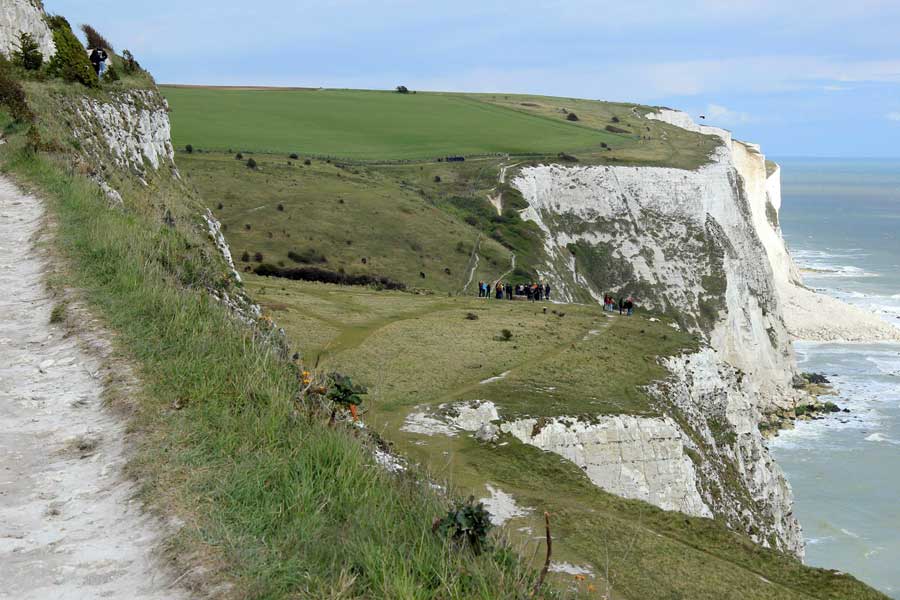 Walkers on grassy slopes of The White Cliffs of Dover