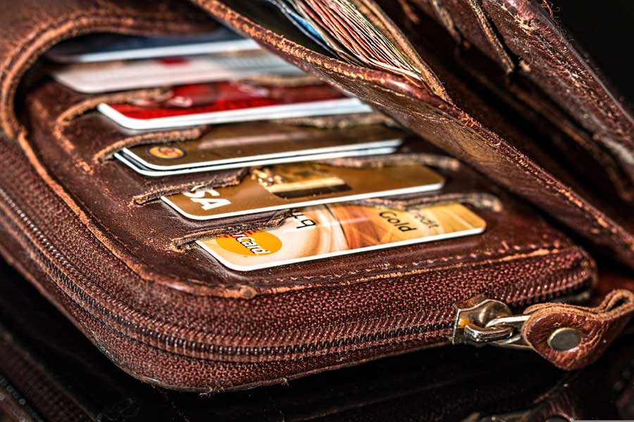 Brown wallet full of credit cards