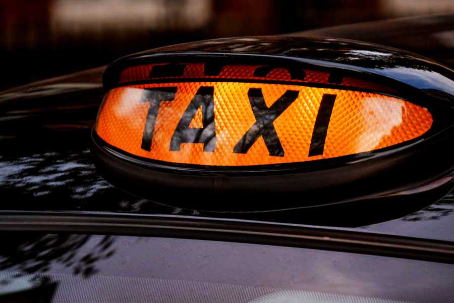London black cab illuminated orange taxi sign