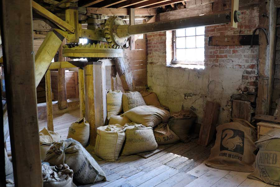 Mill cogs and sacks inside Houghton Mill Houghton Cambridgeshire