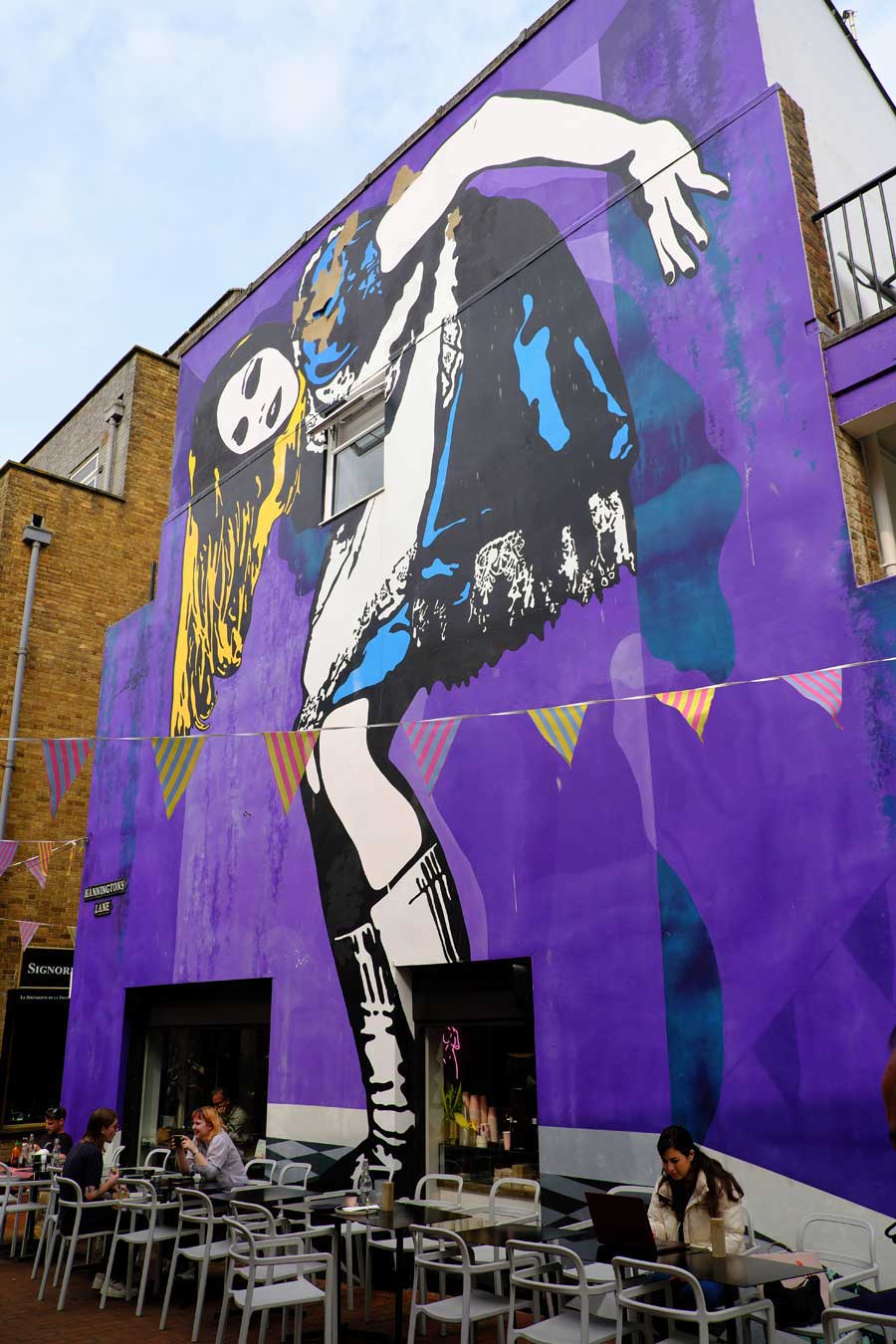 Mural of Alice by Eelus from the book Alice’s Adventures in Wonderland, in Hannington Lane Brighton UK