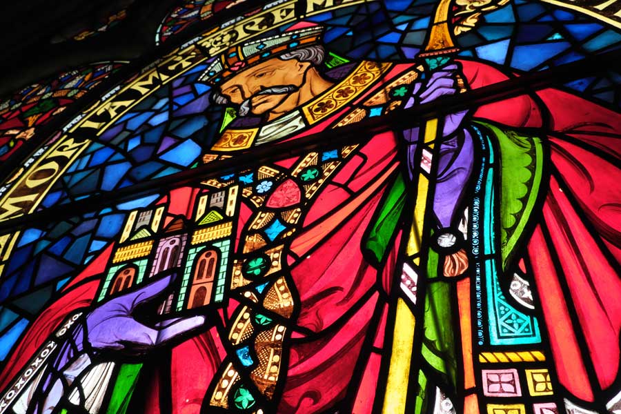 Close up of stained glass window in Lincoln Cathedral West Front showing Bishop Remigius, the cathedral's founder