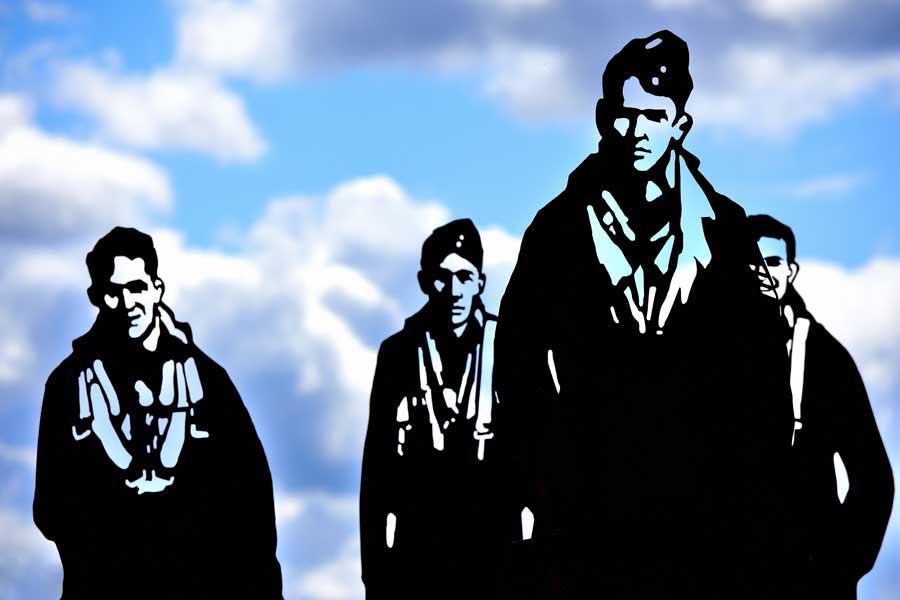The Dambusters Memorial figures in silhouette at International Bomber Command Centre Lincoln UK
