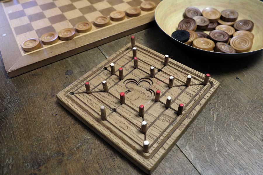 Wooden Medieval board games 9 Mens Morris and draughts at Gainsborough Old Hall, Lincolnshire UK