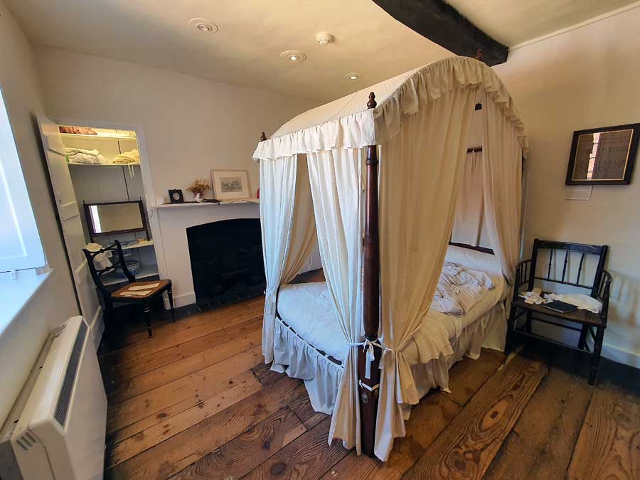 Bedroom with four-poster bed at Jane Austen House, Chawton, Hampshire, UK