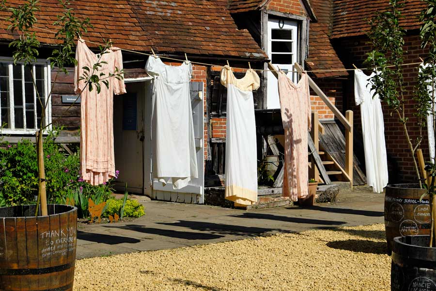 The bakehouse, courtyard and washing on the line at Jane Austen House in Chawton, Hampshire, England