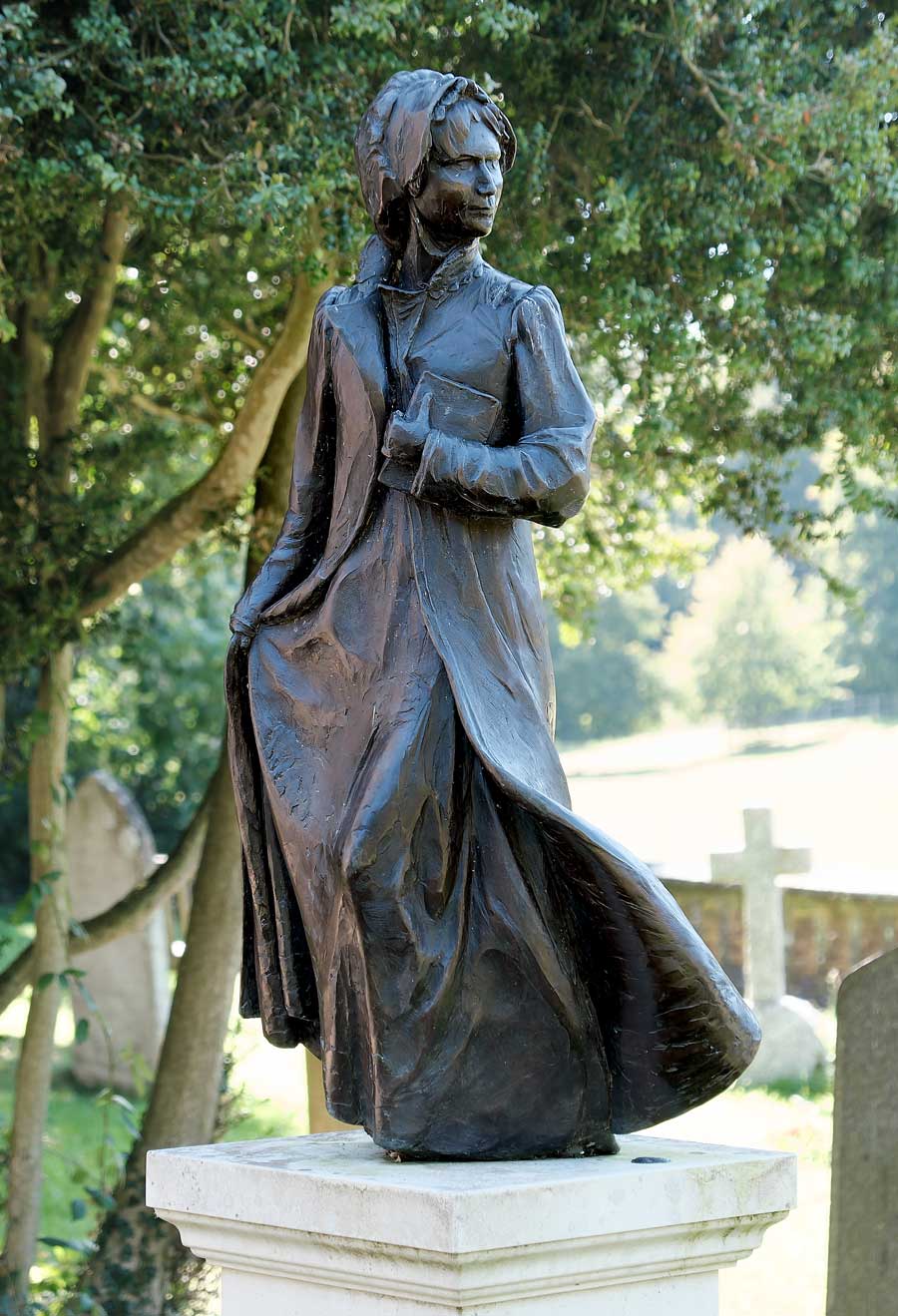 Jane Austen statue at St Nicholas church Chawton, Hampshire UK