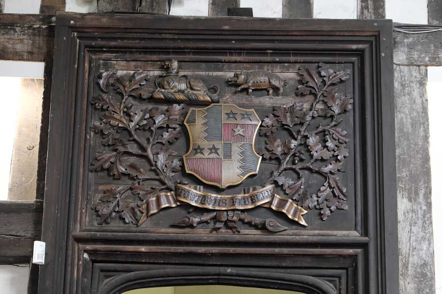 The Burgh coat of arms carved above a door in the Great Hall at Gainsborough Old Hall, Lincolnshire, UK