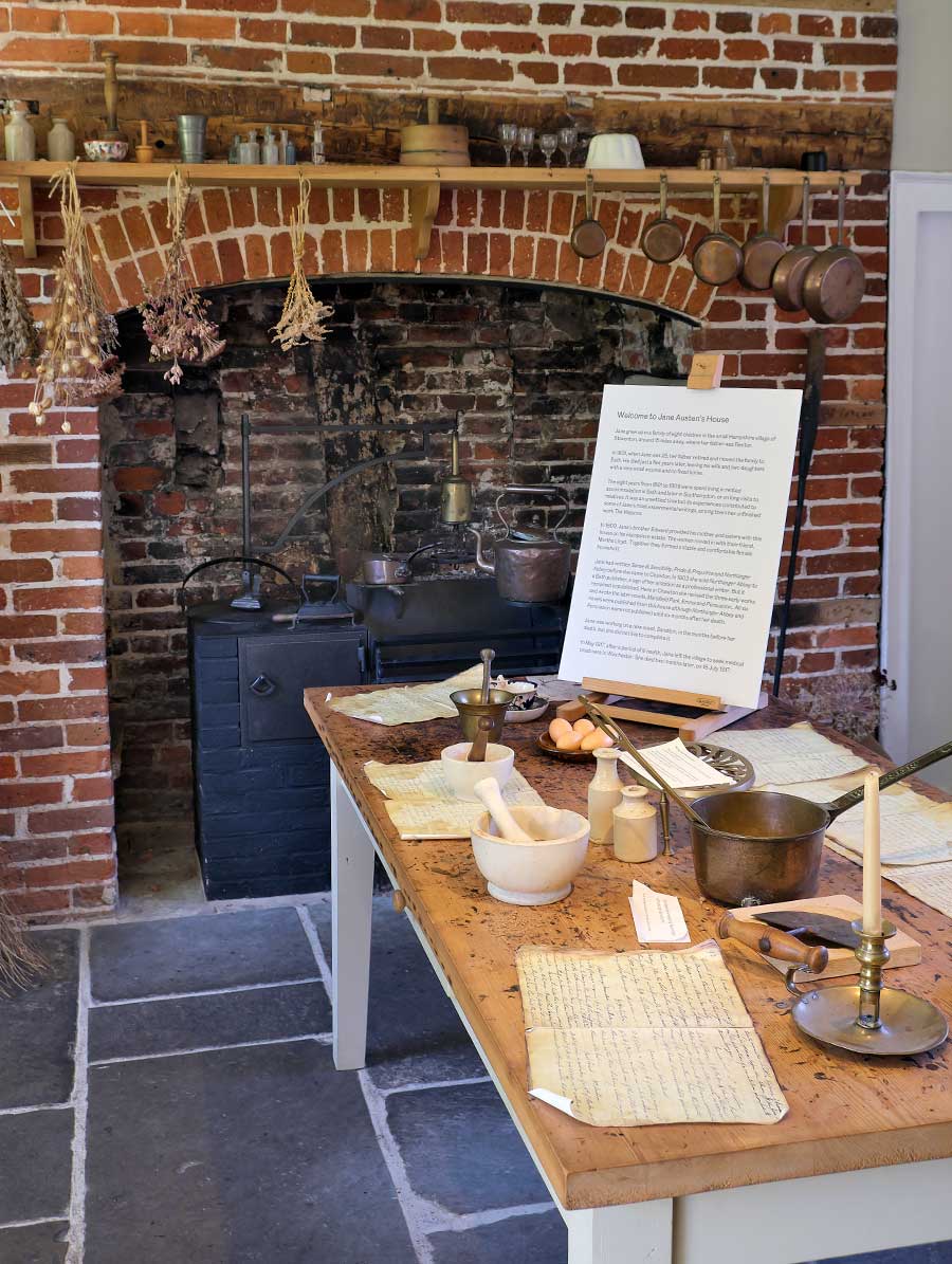 The kitchen at Jane Austen House Chawton, Hampshire UK showing cooking range table and equipment