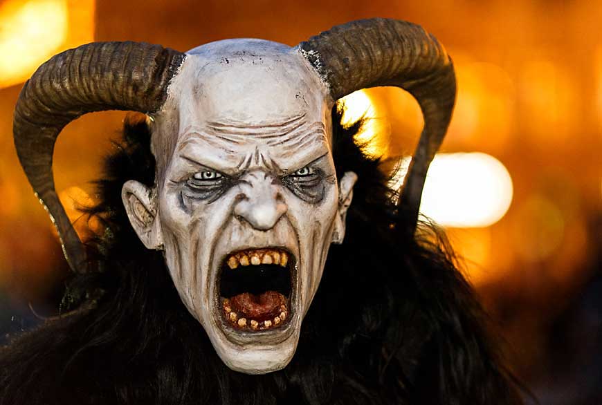 Person wearing a Krampus mask