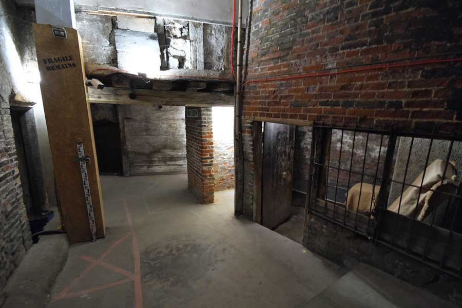 Part of the 15th century hidden street below Norwich UK showing old beams, brickwork and derelict shops
