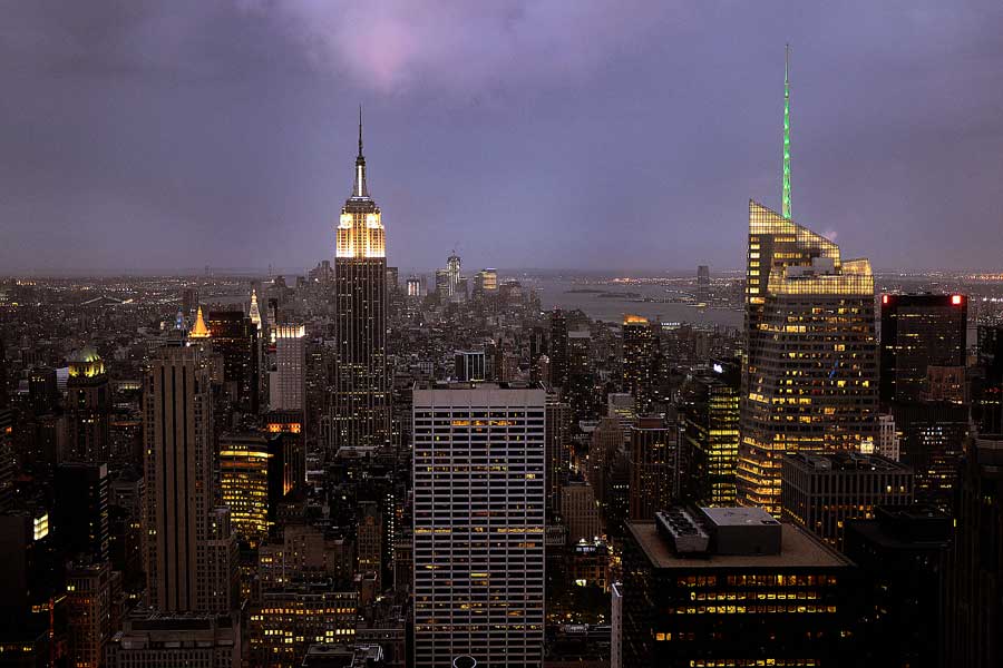Empire State Building and New York skyline at night viewed from the top of the Rockefeller Center