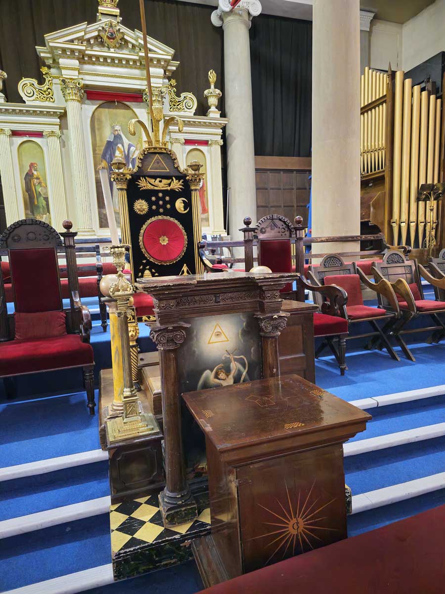 Lodge Master's chair on the Old Theatre Royal stage showing original columns in the Masonic Hall Bath UK