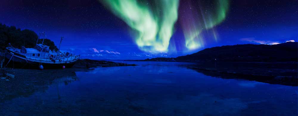 The Northern Lights viewed from a river in Scotland