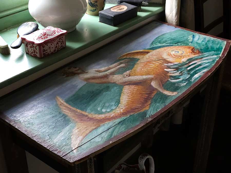 Painted tabletop depicting a naked figure riding a giant fish Charleston Farmhouse Firle East Sussex