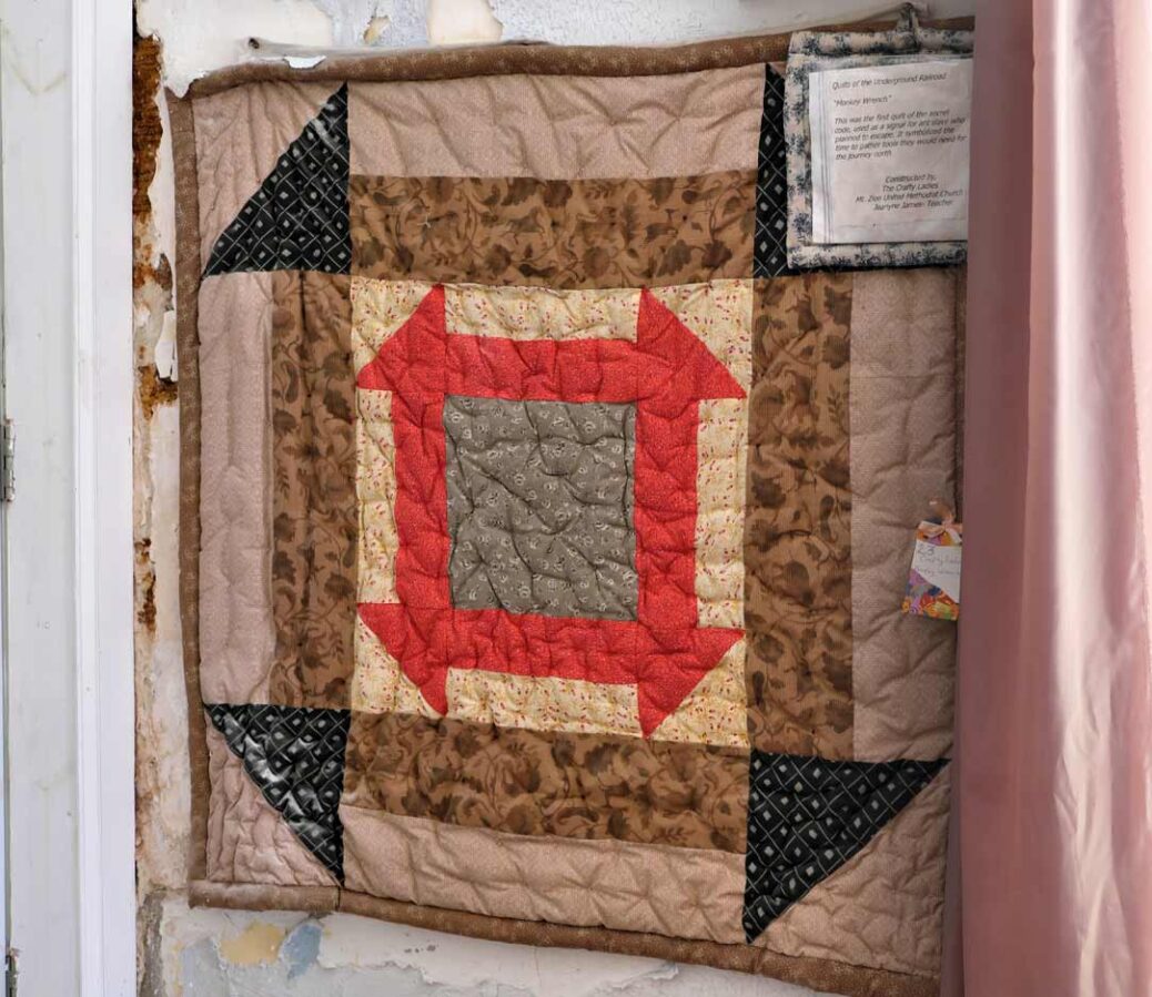 Reproduction of the Monkey Wrench quilt, Belmont Mansion Philadelphia. One of the quilts of The Underground Railroad. Used as a signal for a slave who planned to escape that it was time to gather tools for the journey