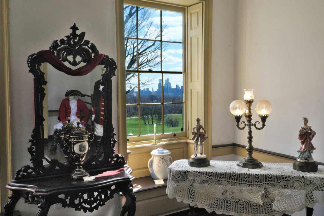 Upper room in Belmont Mansion, Philadelphia with furnishings and ornaments from the Peters family. View from window of the city skyline