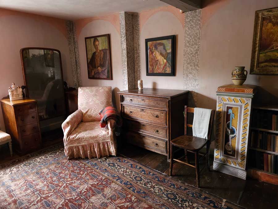 Furniture and paintings in the spare room at Charleston Farmhouse Firle East Sussex