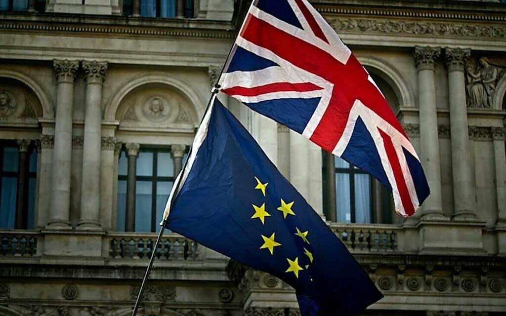 2 flags, one Great Britain and one European Union 