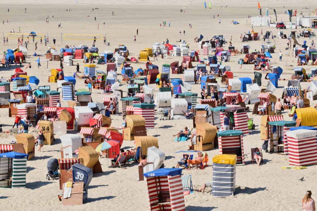 People enjoying the sunshine on a crowded beach

tourist taxes
