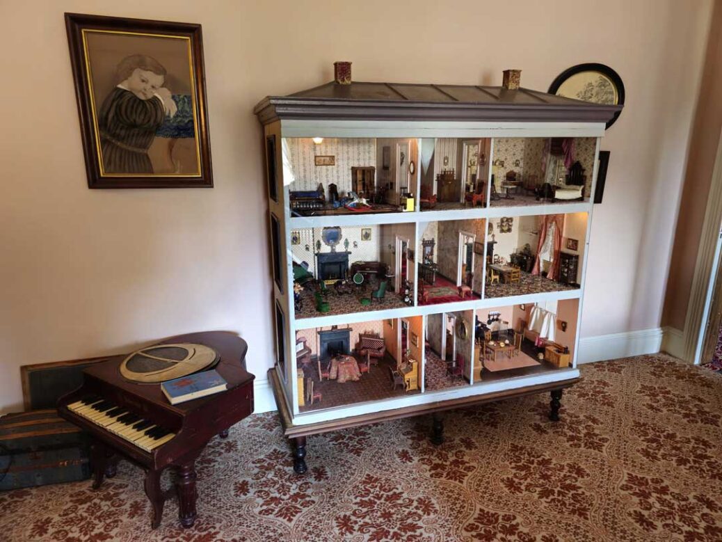 Dollshouse circa 1880 and toy piano in the children's room at Ebenezer Maxwell Mansion Philadelphia