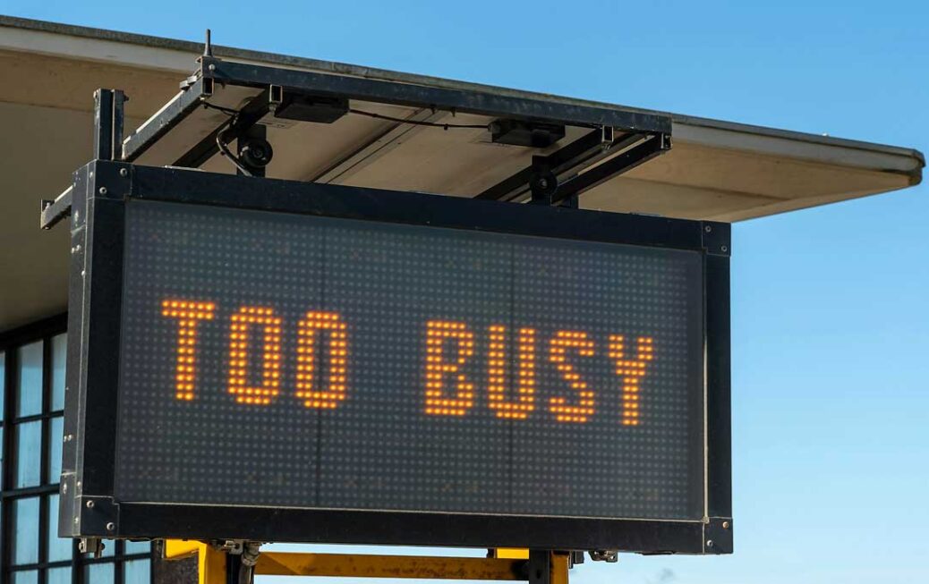An electronic sign on the beach front at Boscombe, Dorset, UK, letting people know that due to the good weather and social-distancing, during lockdown, the beach is too busy