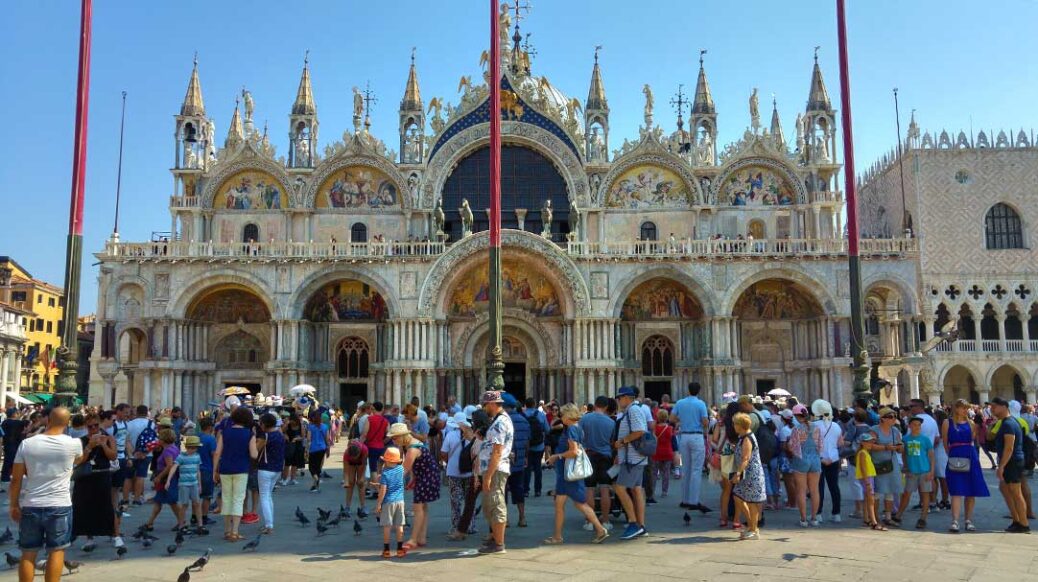 Crowds outside St Mark's Basilica in St Mark's Square Venice Italy