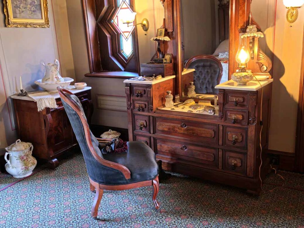 Victorian era dressing table and chair in lady's bedroom at Ebenezer Maxwell Mansion Philadelphia