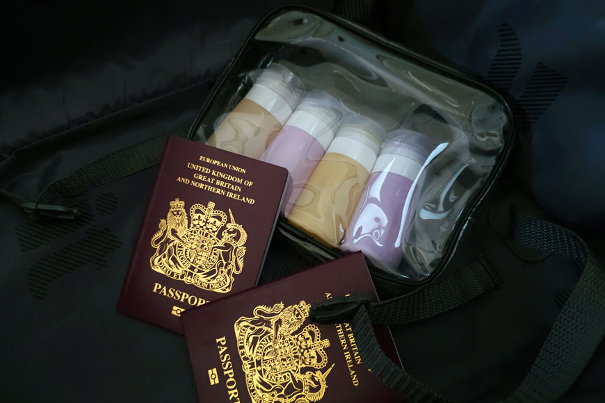 4 x 65ml bottles in clear plastic bag with 2 UK passports in a suitcase
100mls liquid rule