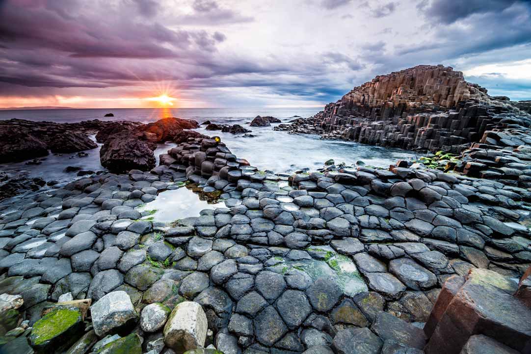 Sun setting at Giant's Causeway in Northern Ireland