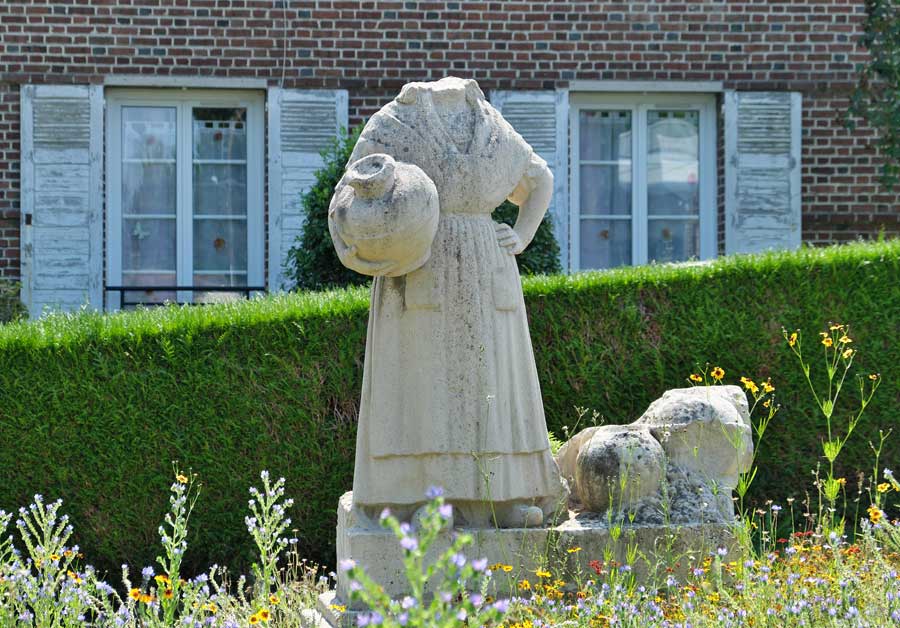 Headless statue of Marie Harel in Vimoutiers Normandy France damaged in a bombing raid 1944