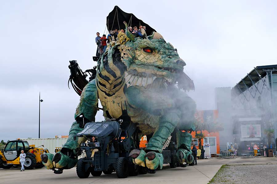 The Calais Dragon moving along the promenade in Calais spurting steam