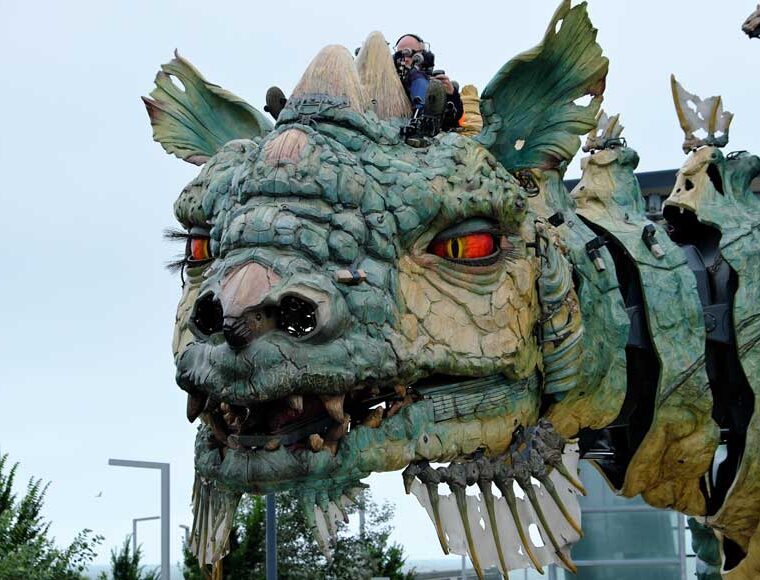 Close up of the head and red eyes of the Calais Dragon in Calais France