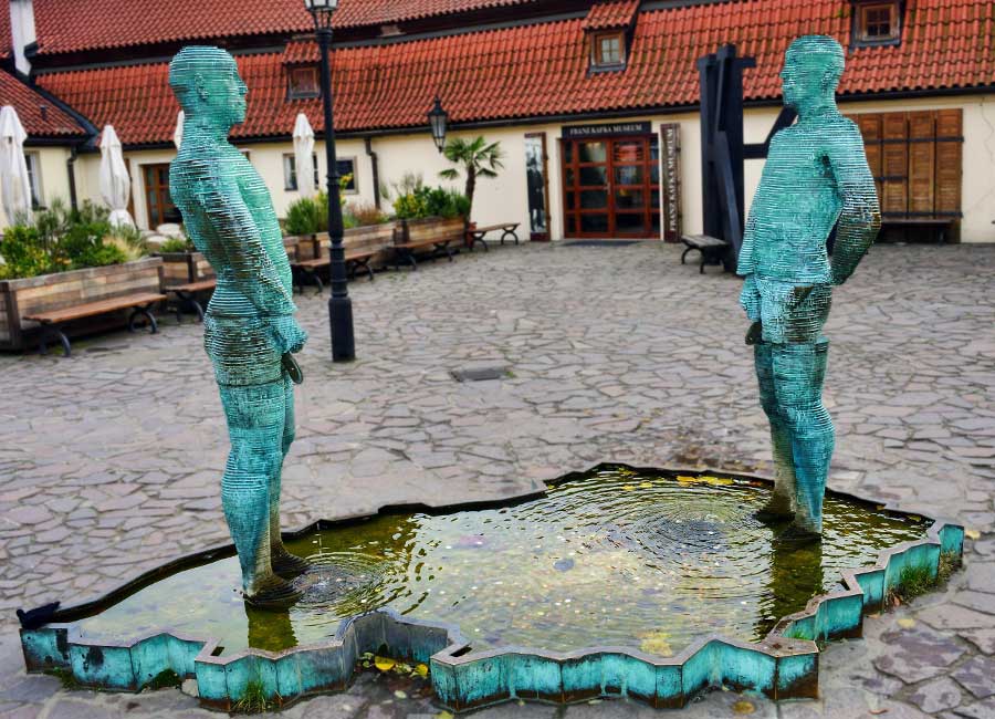 David Černý’s urinating sculptures in front of Franz Kafka Museum. A fountain in the shape of two male figures whose phallus eject water based urine.