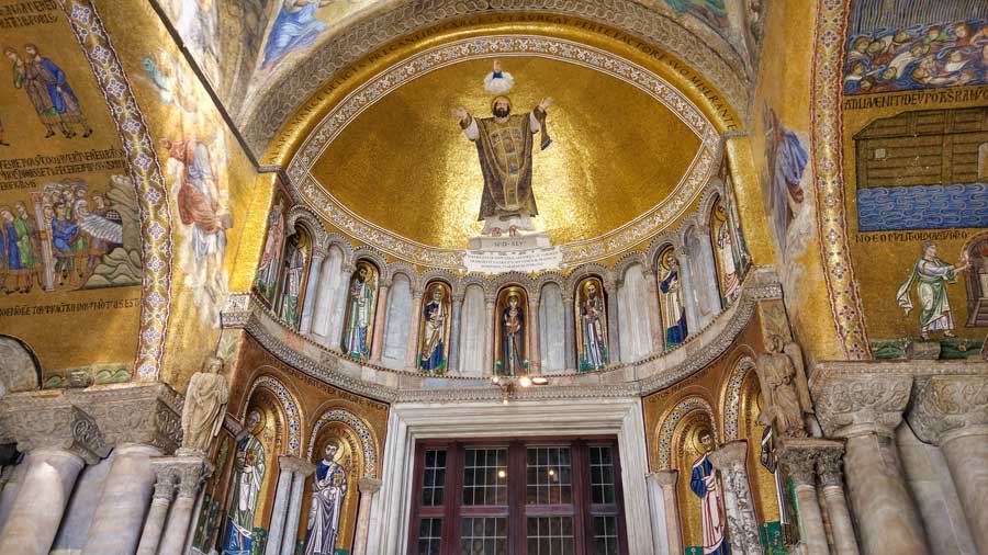 The ornate golden entrance to St Marks Basilica Venice Italy