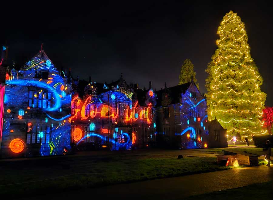 Glow Wild at Wakehurst Winter woodland projection on Wakehurst Mansion facade