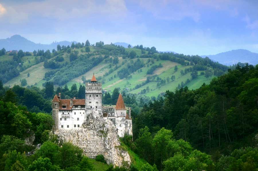 Bran Castle in Romania, surrounded by trees Popular European destinations 2024